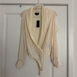 NWT Bebe Long Sleeve Cold Shoulder Cream wrap bodysuit